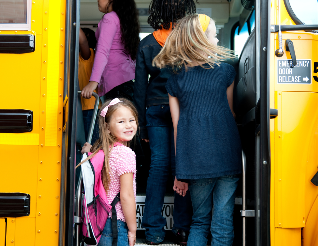 Children getting on school bus